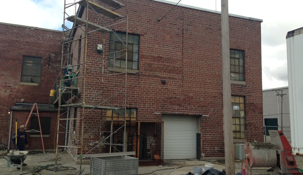 Knauss Property Services - Indianapolis, IN. Restored Building-  1. Bad lintels removed and new installed 2. Tuckpointed all  3. Following year Waterproof coated wall.  Central Indiana