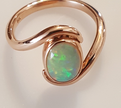 Inspired Jewelers - Los Alamos, NM. Custom designed 14k Rose Gold ring with Bezel set Opal