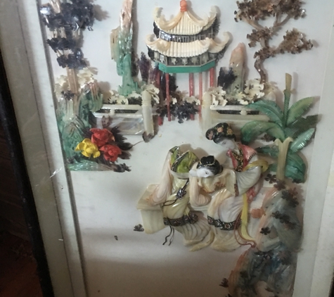 Avondale Estate Sales - Jacksonville, FL. An enclosed glass Chinese scene of jade/mother of pearl.  One head is loose