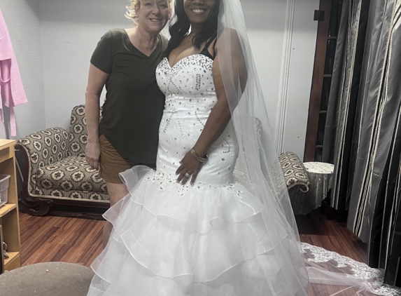 It's Sew Monica - Minden, LA. Mrs Monica was everything to me she went above and beyond for my dress and veil!! I broke my ankle before my wedding and had to wear a boot she made sure you couldn’t see it!!!