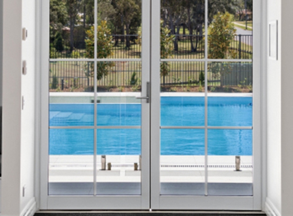 Bradnam's Windows & Doors - South Murwillumbah, NSW. White Aluminium Hinged Door With Colonial Bars