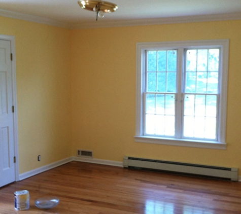 Precision Painting Plus of Nassau County - Westbury, NY. yellow-bedroom-painting-Manhasset