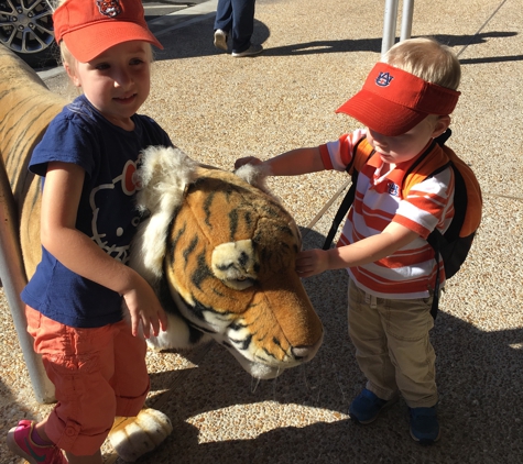 AuburnArt.Com - Auburn, AL. It's fun to pose with the tiger outside the Auburn Art store!