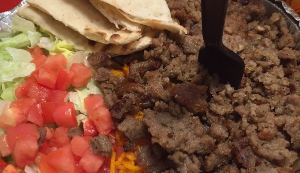 The Halal Guys - Las Vegas, NV. Gyro beef platter. There's a mountain of fluffy rice on the bottom. Rice was the best part of the meal.