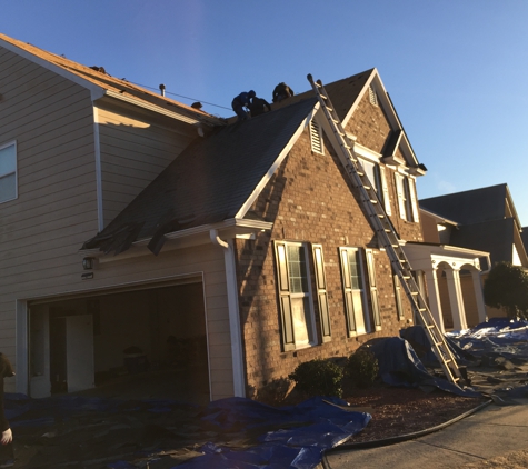 MDJ Roofing & Construction - Lawrenceville, GA. Removing existing roofing shingles by MDJ Roofing and Construction