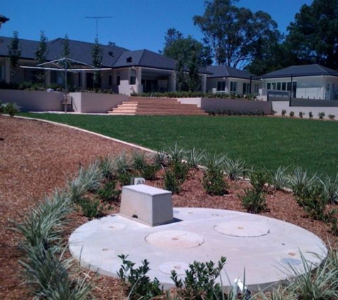 Warrick Osborne H20 Septic Services - Walang, NSW. Single septic tank in garden bed
