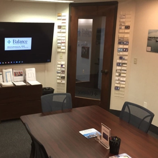 Balance Wealth Advisors - Wellesley, MA. Wellesley conference room and our referral wall of business cards.