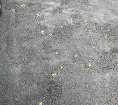 Fleming Asphalt - York, PA. Can you see the maybe half inch of blacktop that was laid?! This was done in July 2017 and this pic was taken this week. Unreal.