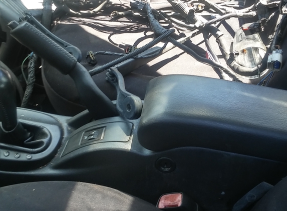 Deno's Automotive - Los Angeles, CA. Cords everywhere...they sabotage my car..inside and out..