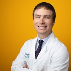 John M. Belz, MD