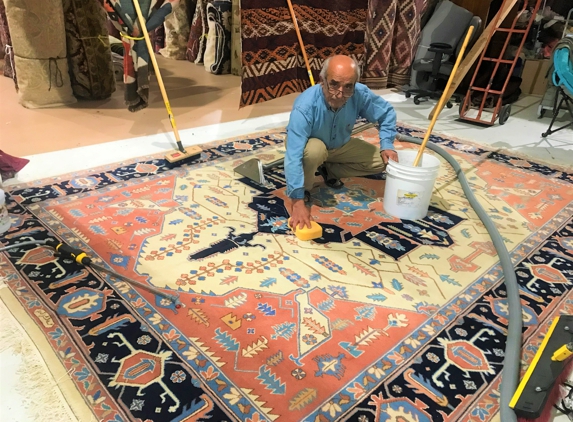Bay Area Rug Cleaners - San Mateo, CA. Ali cleaning a Persian Heriz Rug.