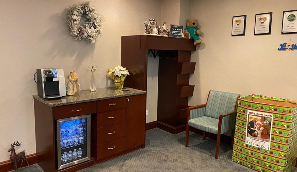 Passes Dental Care - Great Neck, NY. Reception area and refreshment station at Great Neck dentist Passes Dental Care