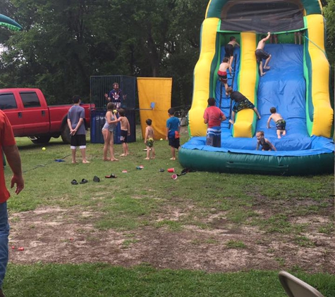 Jolly Jumpers Moonwalk Rentals - Deer Park, TX. Dunking the coach, and having a blast going down (or up?) the water slide! Awesome baseball end of season team party! Thanks, Jolly Jumpers!