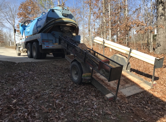 JDS Septic & Services. Excavator off the truck to dig the necessary hole.