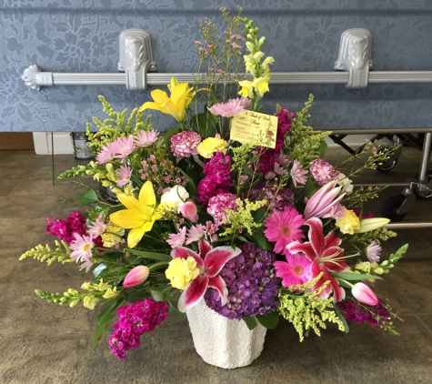 A Touch Of Class Florist - Vestavia, AL. Beautiful mix of holland flowers in a  mâché disposable container.