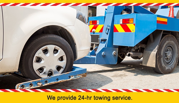 T & M Auto Repairs. We provide 24-hr towing service.