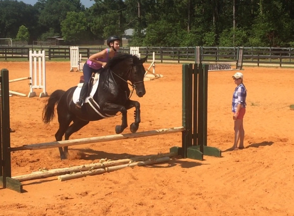 J.C. North Farm - Folsom, LA. My daughter taking a lesson in the outdoor arena.