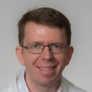 Charles E. Degravelles, MD