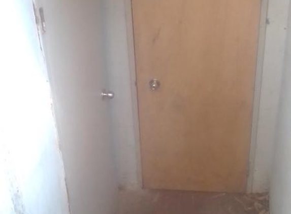 Access Strata Pty Ltd - Northmead, NSW. Just one of the many unpainted doors around the block