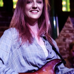 Root Note Studio - Nashville, TN. Meet Liz, our guitar instructor. Learn more about her by visiting her website at www.lizlawrenceguitar.com/lessons.