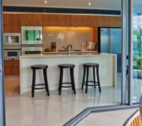 Bradnam's Windows & Doors - Mount St John, QLD. Ultra Silver Aluminium Corner Sliding Door