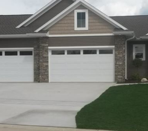 Adams Door Inc. - Cedar Rapids, IA. residential garage door with windows