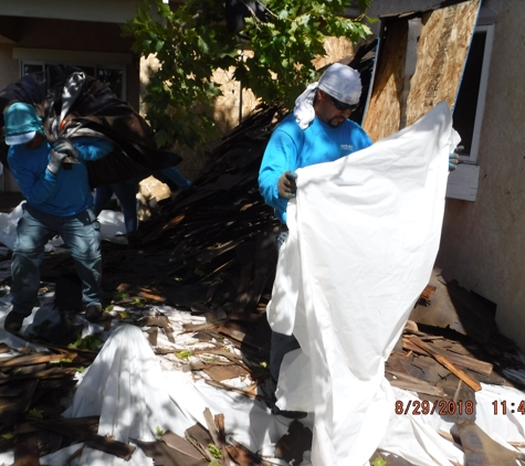 Sierra Roofing and Solar - Dublin, CA. Wood shake tear off being bundled by our crew to then be hauled into the truck