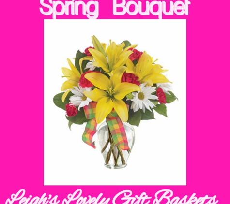 Leigh's Lovely Gift Baskets - Pittsburgh, PA. Yellow Lilies,
Red Carnations and White Daisies 
arranged in a clear glass vase with ribbon. http://bit.ly/leighslovelygiftbasketsflowershop