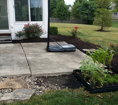 E.T Lawn Care - Loveland, OH. weeds starting to show/mulch not finished