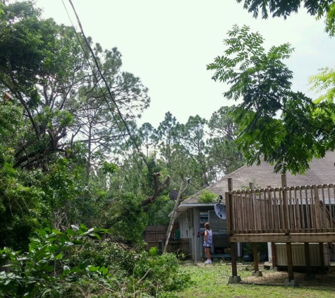 A Pro Quality Electric Service Corp - Palm Bay, FL. Gary and his wife cutting back the trees at my daughter's house