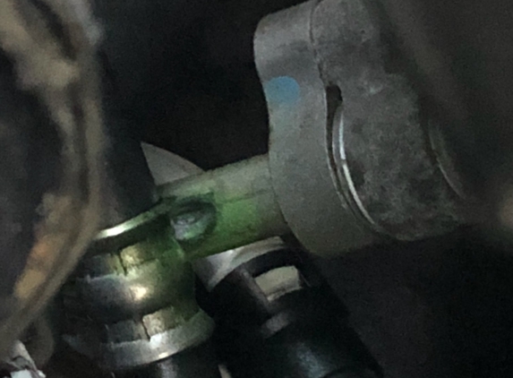 JD Byrider - Indianapolis, IN. Power steering line pushed against ac line. Green dye shows the worn hole.