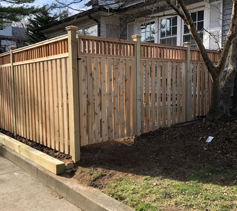 Serrano Fence & Son, Inc. - Island Park, NY. semi privacy cedar wood sections with closed spindle topper and 6x6 treated retaining wall