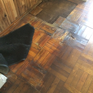 A Dan The Handyman - Santa Ana, CA. Removed damaged hardwood floor....