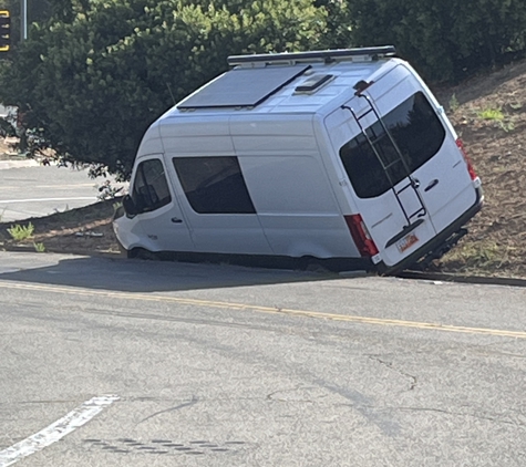 S & K Towing Inc. Camper van in V-ditch