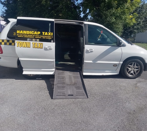 CHARLES TOWN TAXI - Charles Town, WV. Left side of the handicap van; it also has a ramp for wheelchair users