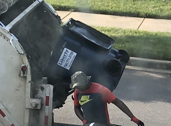 Liberty Waste Service - Rock Hill, SC. Photo of trash and recycling being disposed of in the same truck.