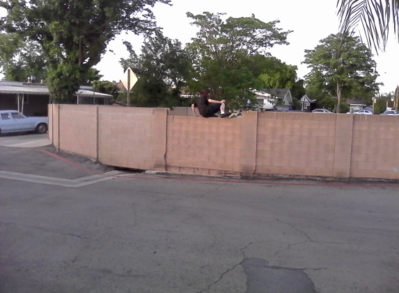 Rancho Riverside Mobile Country Club - Riverside, CA. Teenagers jumping over the broken wall!  Over a year now and Newport Pacific still haven't fixed it...  Uggggggggh...