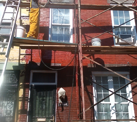 Higgins Cement - Philadelphia, PA. Remove paint clean bricks grind out cement joints breakpoint paint corners call window restoration front of house