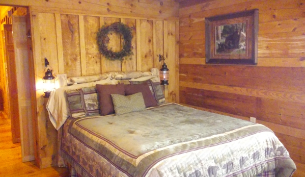 Croys Cabins & Hunting lodge and cabin & suite rentals - greeneville, TN. Queen size log bed