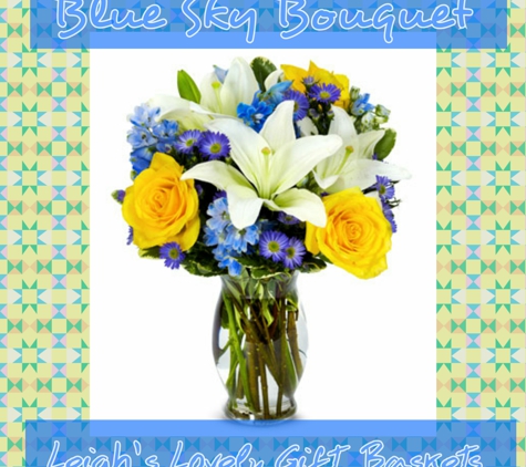 Leigh's Lovely Gift Baskets - Pittsburgh, PA. White Lilies,
Yellow Roses, Blue Delphinium and Purple Monte Casino arranged in a glass vase. 
http://bit.ly/LLGBblueskybouquetwithvase 