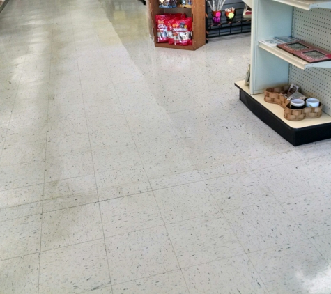 Extreme Clean Carpet & Floor Care - Normal, IL. Scrubbing a commercial floor with a product that cuts through the dirt/grease. High-quality work at a fair price.