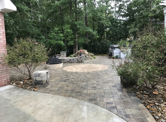 Yardscapes Landscaping and Hardscapes - New Bern, NC. Paver Patio with Sitting Walls, Fire Pit and Waterfall.