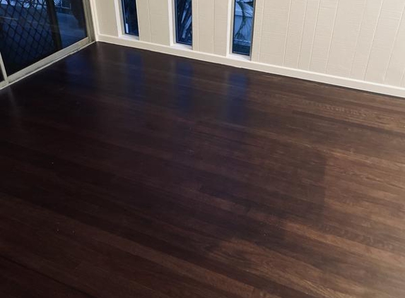 Glenn Mills Floor Sanding & Polishing - Townsville, QLD. Floor with desk lines showing poor application of colour tint