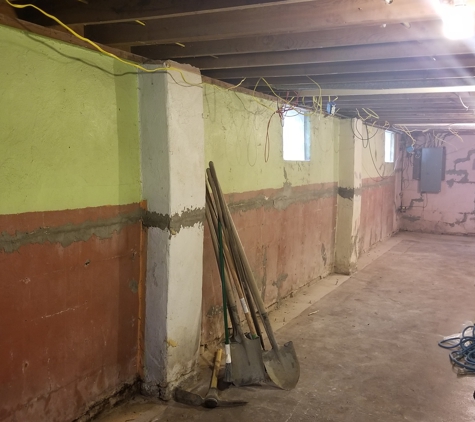 The Foundation Specialists - Milford, OH. Bowed and cracked foundation walls revealed after demo