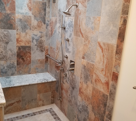 Absolute Interiors and Design, LLC - Cleveland, OH. Custom shower with granite bench and body jets