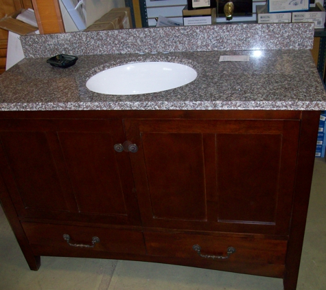 Cabinet Surplus. Williamsburg Vanity with granite top