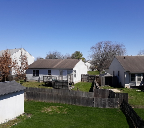 Arbaugh Tree Service OH - Carroll, OH. After 25 foot tall Weeping Willow was removed (brown round section)