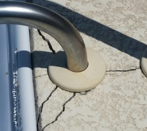 Precision Inspection Services LLC. Cracks in the concrete at the support rail.