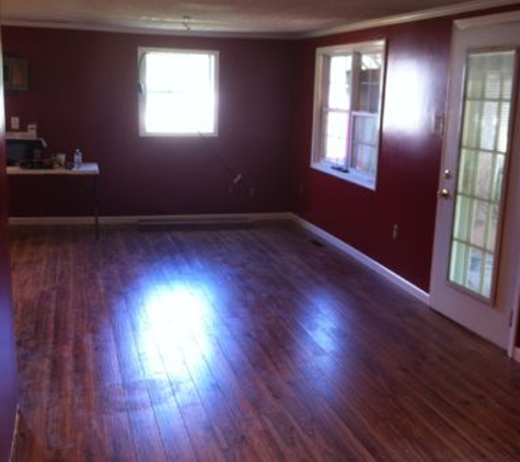 Cavinder Remodeling - Hopkinsville, KY. New floating floor! Paint! Tore out load bearing wall for open floor plan!