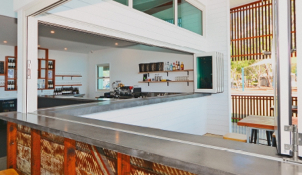 Bradnam's Windows & Doors - Mount St John, QLD. White Aluminium Bi-fold Windows
